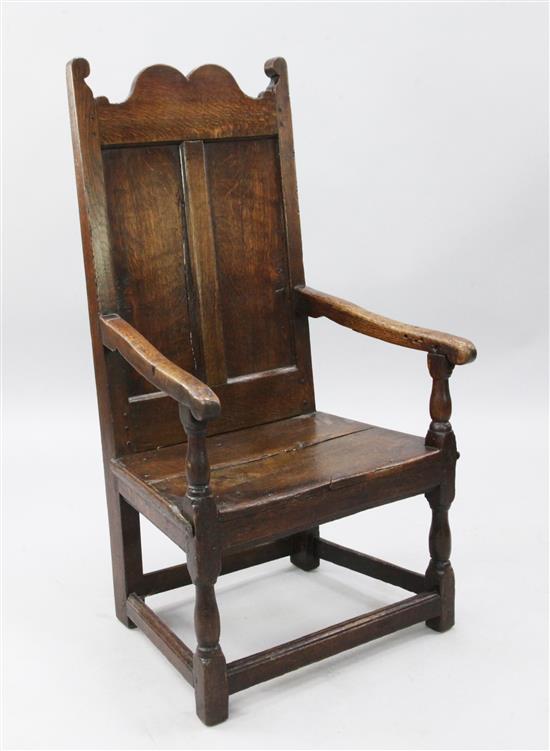 A 17th century oak armchair, H.3ft 8in.